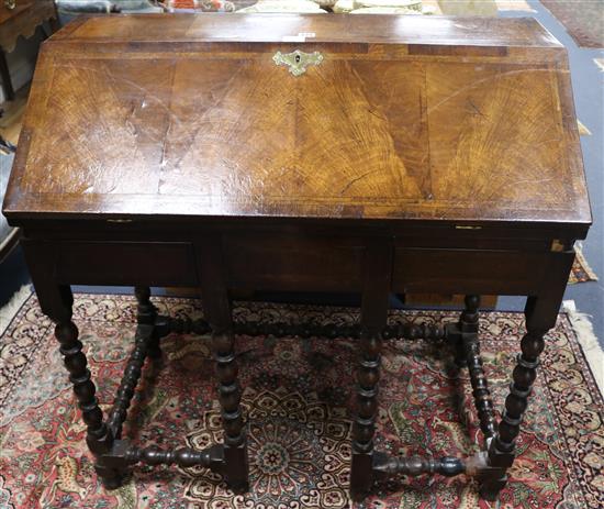 The upper portion of an early 18th century herringbone crossbanded bureau with fitted interior, W.96cm